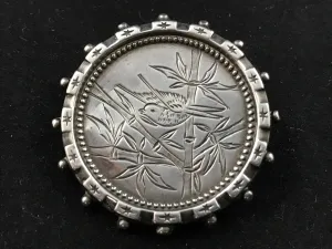 Victorian silver Aesthetic Movement brooch engraved with a bird in bamboo