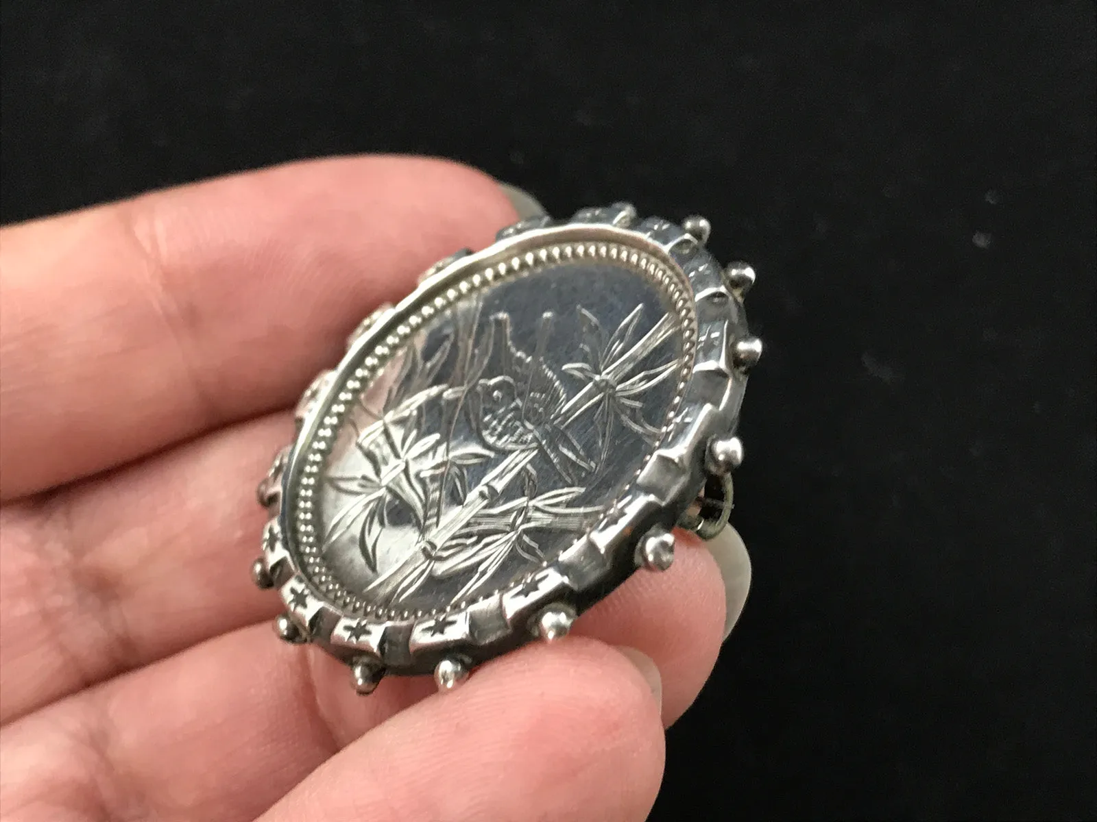 Victorian silver Aesthetic Movement brooch engraved with a bird in bamboo